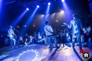 Live band shot playing on stage