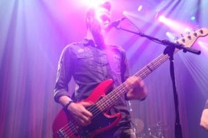 Singing and Playing Guitar on Stage
